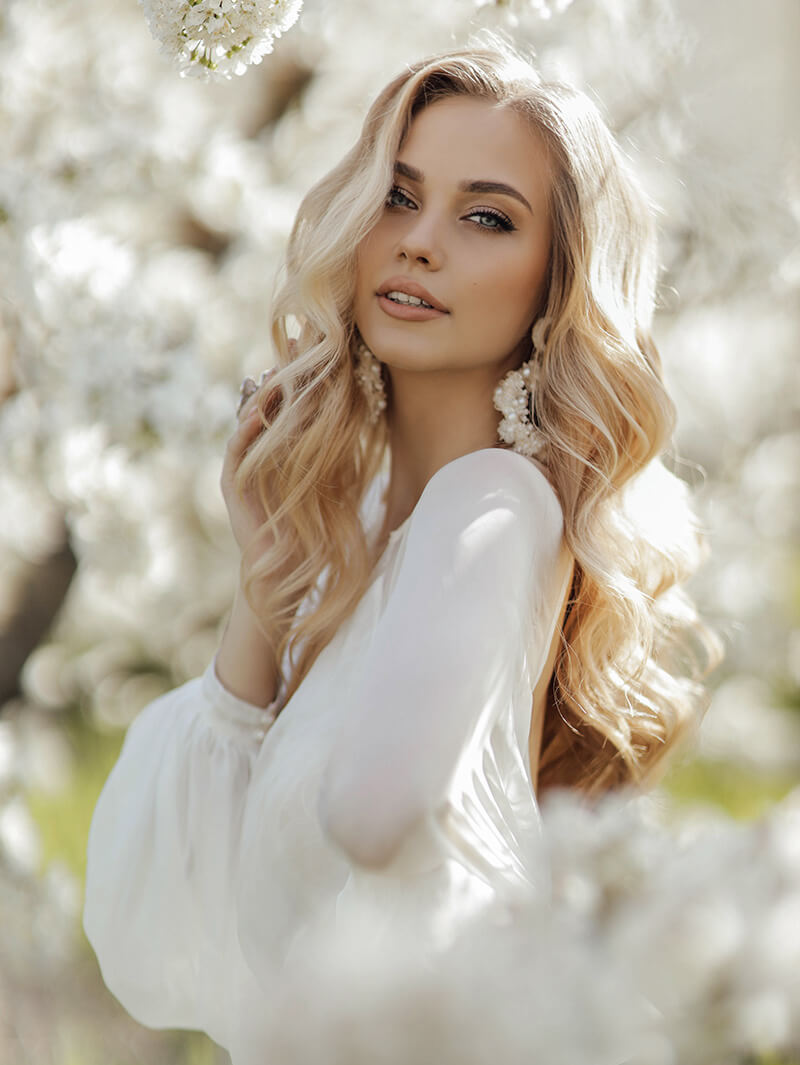 A woman in white outdoors