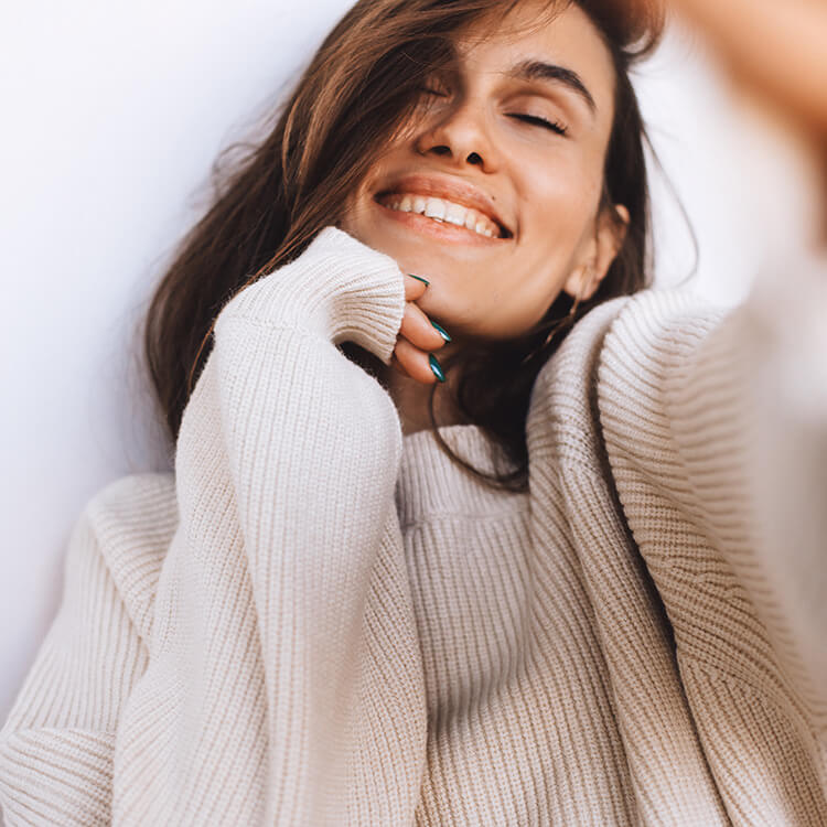 Young woman in a white sweater