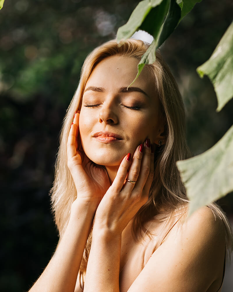 Woman touching her face